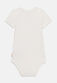 Κορμάκι με κοντά μανίκια από βαμβάκι σε κρεμ απόχρωση, με στρογγυλή λαιμόκοψη και κούμπωμα με κουμπιά στο κάτω μέρος για εύκολο ντύσιμο. Ομαλή υφή.