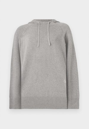 Grå hettegenser laget av myk, strikket stoff. Har en ribbestrikket kant og mansjetter, samt snorer for justerbar passform.