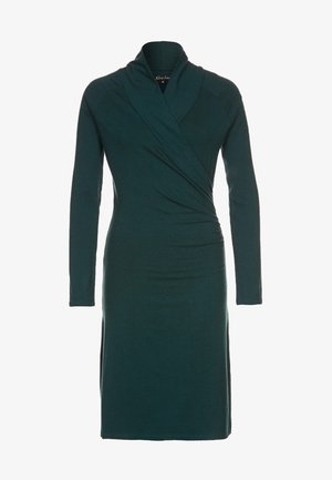 Robe enveloppante à manches longues en tissu doux couleur bleu canard. Dotée d'un décolleté en V profond et de fronces sur le côté, créant une silhouette ajustée. Texture lisse.