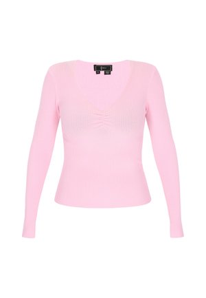 Lyserød ribbet bluse med lange ærmer, dyb V-udskæring og samling i midten. Blødt materiale, tætsiddende design, mærker synlige ved halsudskæringen.