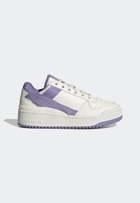 White sneaker with purple accents, smooth leather and textile upper, round toe, thick textured sole, and distinct branding detail on the side.