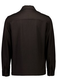 Schwarze Langarmjacke mit geknöpften Manschetten und einer geraden Rückennaht, von hinten vor weißem Hintergrund gezeigt.