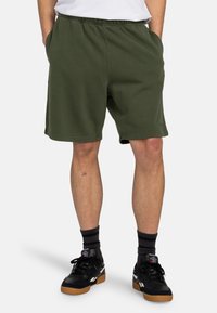 Olive green shorts made of cotton blend, featuring an elastic waistband, side pockets, and a relaxed fit.