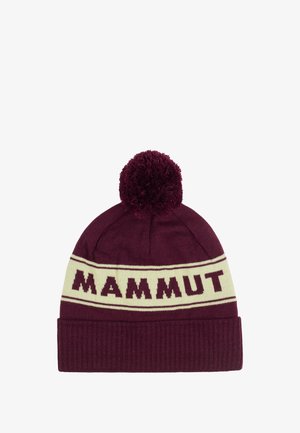 Bordowa dzianinowa czapka z kremowym paskiem z napisem "MAMMUT" w ciemnoczerwonym kolorze. Uzupełniona puszystym pomponem i prążkowanym mankietem dla uzyskania tekstury.