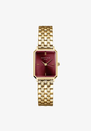 Reloj rectangular dorado con esfera burdeos, con acentos dorados, dos manecillas y una pulsera de eslabones dorados. Nombre de la marca: Rosefield.
