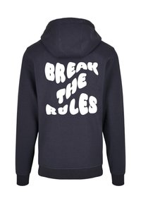 Marineblaues Hoodie mit lockerer Passform, das auf der Rückseite einen großen weißen Schriftzug "BREAK THE RULES" zeigt. Weicher Stoff mit strukturierter Oberfläche.