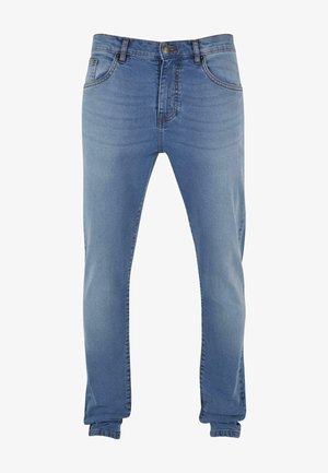 Light blue denim jeans with a slim fit, featuring a button closure, five pockets, and subtle stitching details along the seams.