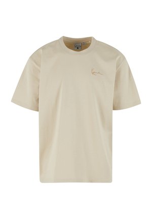 Bézs, rövid ujjú pamut póló, finoman hímzett logóval a bal mellrészen és klasszikus kerek nyakkivágással.