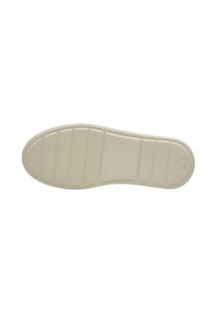 Rubber shoe sole in off-white, featuring horizontal lines and textured grip patterns for traction. Smooth surface with rounded edges.