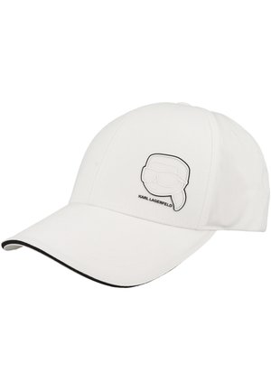 Weißes Baseballcap mit schwarzem Rand am Schirm und einem kleinen Karl Lagerfeld Logo-Patch mit einem stilisierten Gesicht mit Sonnenbrille.