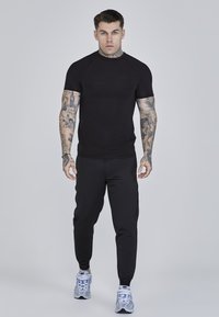 SIKSILK JOGGERS - Tracksuit bottoms - black