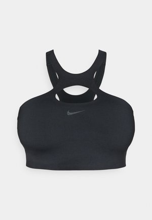 Svart sports-bh med utskjæringsdesign og tykke stropper, med en liten sølvlogo foran. Glatt, elastisk stoff.