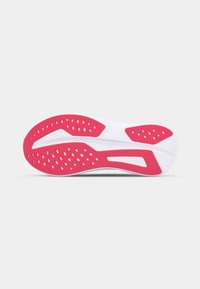 Shoe sole with white and vibrant pink rubber. Features circular cutouts for traction, textured patterns, and a streamlined design.