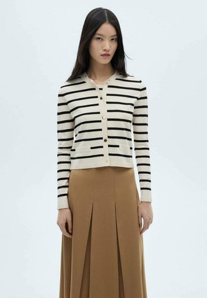 Striped cardigan made of soft fabric, featuring black stripes on a beige background, with a button-up front and a cropped design.
