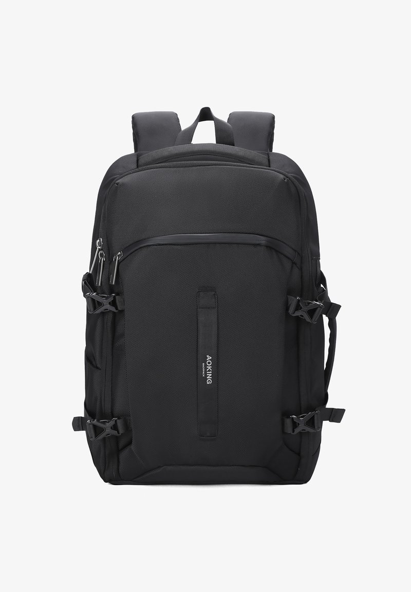 Zwarte rugzak met gestructureerde stof, meerdere ritsen, verstelbare schouderbanden en zijclips voor compressie. Voorzien van een centraal logo label.