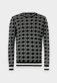 Juodas megztinis su geometriniu baltu raštu, apvalia iškirpte, ilgomis rankovėmis ir briaunuotomis rankogaliais bei apačia su kontrastingomis juostelėmis.