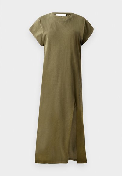 Olive green, knee-length dress made of soft cotton with short sleeves, round neckline, and a side slit for mobility. Simple and unadorned design.