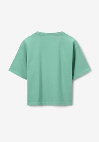 Chemise en coton à manches courtes de couleur menthe douce, avec une texture côtelée et un col rond classique. Lignes épurées et coupe décontractée.
