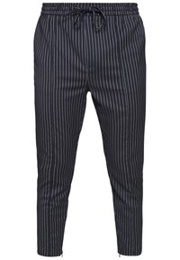 Navy instickade byxor med elastisk midja och justerbar dragsko. Har smalnande ben och blixtlås vid anklarna för en figurnära silhuett.