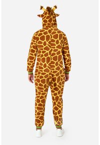 Tutina a tema giraffe realizzata in morbido tessuto, con stampa giraffa marrone e gialla, cappuccio con orecchie e polsini verdi.