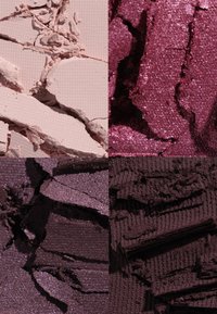 Four textured cosmetic powders: light pink matte, deep burgundy shimmer, dark purple shimmer, and rich brown matte, with varying surfaces and cuts.