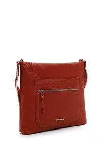 Red leather crossbody bag with pebbled texture, featuring a front zip pocket, adjustable strap, and metallic logo detail.