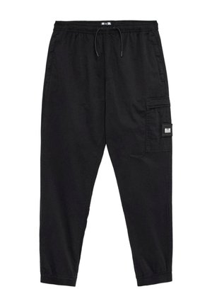 Black cargo pants with an elastic waistband, drawstring closure, tapered legs, and a side pocket featuring a small label.