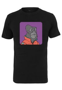 Fekete pamut póló, amelyen egy narancssárga dzsekis gorilla grafikája látható, lila háttérrel körítve. Rövid ujjú és kerek nyakú.