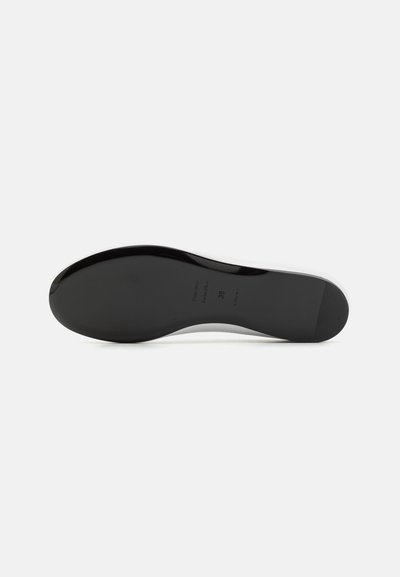 Black shoe sole with a smooth, glossy finish, featuring a rounded shape and subtle embossed branding. Size marked as 39.