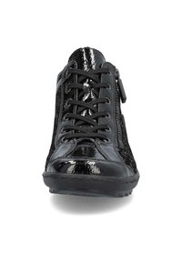 Black patent leather sneaker with a lace-up front, zip side, and textured surface. Features a rounded toe and a rubber sole.