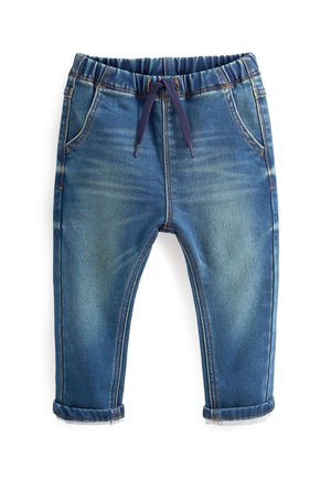 Blå denimjeans med elastisk talje, op rullede manchetter og forlommer, der har snøre i taljen.