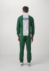 Lacoste Sport - TRACKSUIT MEDVEDEV - Melegítő - green/white Miniatűr kép 1