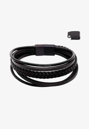 Juodas odinis apyrankė, kurią sudaro trys susipynusios gijos: viena lygi, viena pintinė ir užsegimo dizainas. Pridedamas atskiras juodas magnetinis užsegimas.