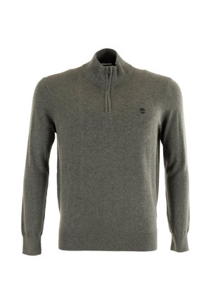 Suéter gris de punto, con un alto cuello y cierre de media cremallera. Incluye un pequeño logo en el lado izquierdo del pecho.