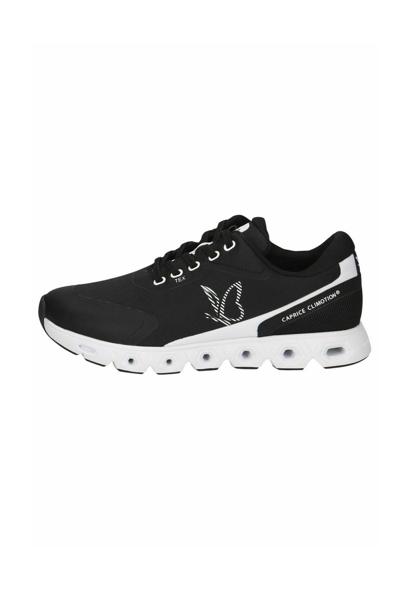 Black athletic shoes with a textured fabric upper, white sole featuring hexagonal cutouts, and a butterfly logo on the side.
