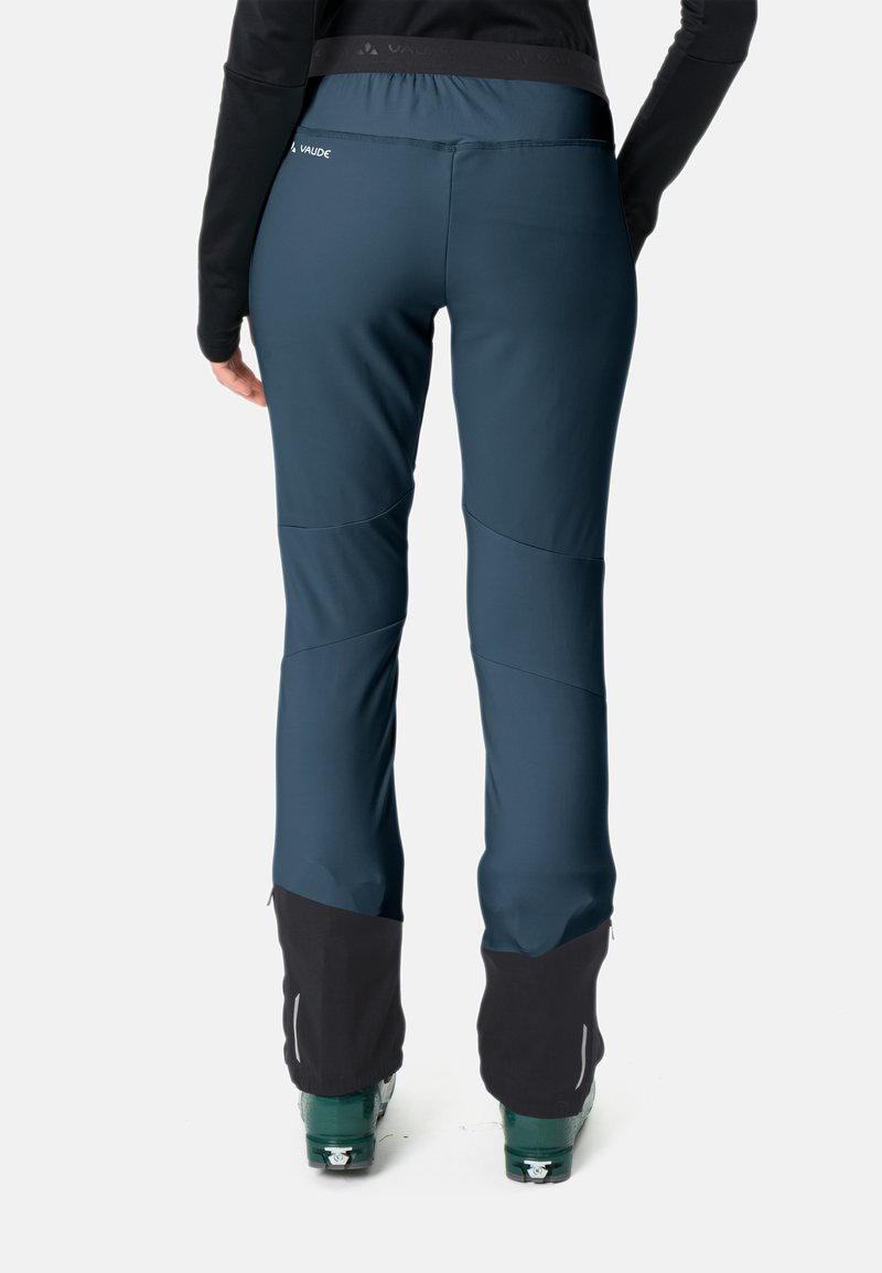 Dunkelblaugrüne Skihosen mit schmalem Schnitt, ergonomischem Design und schwarzen Akzenten an den Säumen. Hergestellt aus flexibel und wetterbeständigem Material.