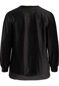 Czarna bluzka z długim rękawem, z delikatnym ukośnym wzorem w srebrne kropki, z marszczonymi mankietami i okrągłym dekoltem, pokazana z tyłu.