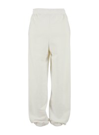 Lystfarvede, løstsiddende sweatpants med elastisk talje og elastiske manchetter ved anklerne, lavet af blødt, struktureret stof.