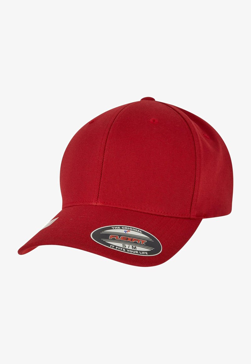 Red baseball cap made of fabric with a slightly textured finish. Features a curved visor and a branded sticker on the front.