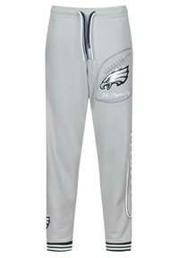 Grå bomulds sweatpants med et ørnelogo og teksten "Fly Eagles Fly". Elastisk talje med snøre, ribbede manchetter og grafik på siden.