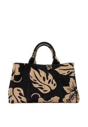 Sort stofnet med store beige tropiske blade og blomsterprint samt korte håndtag.