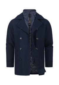 Marineblå uld peacoat med dobbeltradet front, fremtrædende knapper og kviltet inderside. Har en klassisk krave og sidelommer.