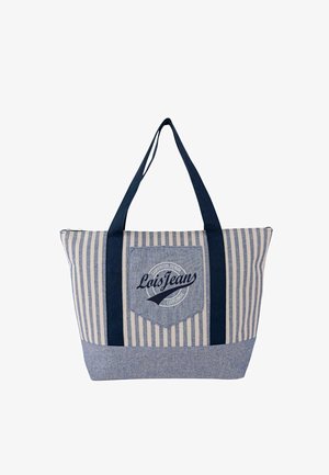 Bolsa tote de algodón a rayas con asas azul marino, que cuenta con un parche con logo y cierre de cremallera. El diseño incluye rayas verticales azules y crema.