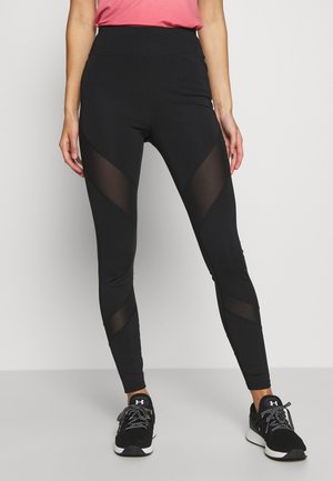 Black athletic leggings featuring a high waistband, mesh panel accents, and a fitted design for ease of movement.