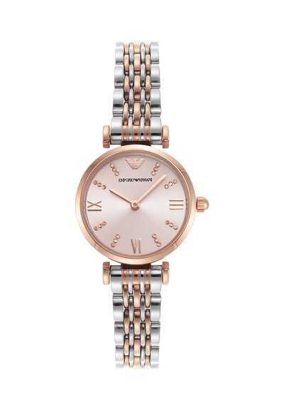 Braceletur af rosaguldsmetal og sølv med rund lyserød urskive, minimalistiske rosaguldsvisere, krystallinske timemarkører og romertal ved 3, 6, 9.