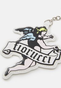 Fiorucci keychain. Soft rubber, angel design in black, blue, and yellow. White border with a banner displaying "fiorucci" in black lettering.