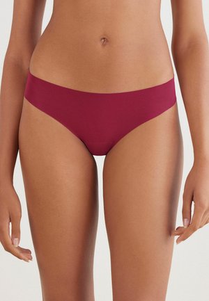 Burgundy bikini underwear with a smooth texture, low-rise design, minimal coverage, and no visible seams for a seamless look.