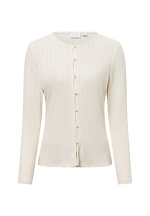 Cream ribbed long-sleeve cardigan with a rounded neckline, featuring button closure decorated with small pearl-like accents. Soft texture.