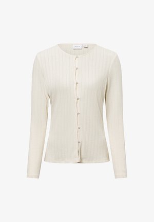 Cream ribbed long-sleeve cardigan with a rounded neckline, featuring button closure decorated with small pearl-like accents. Soft texture.