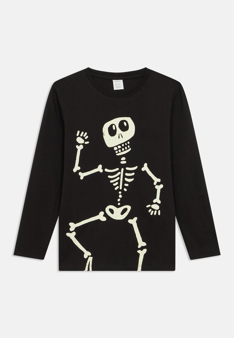 Black long-sleeve shirt featuring a white skeleton graphic. The design includes a smiling skull and bone details, with a crew neck.